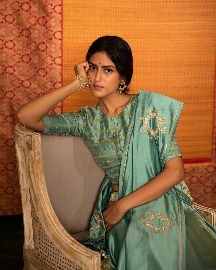 teal half and half hand embroidered saree with blouse