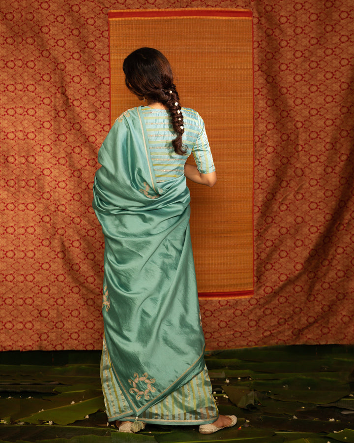 teal half and half hand embroidered saree with blouse