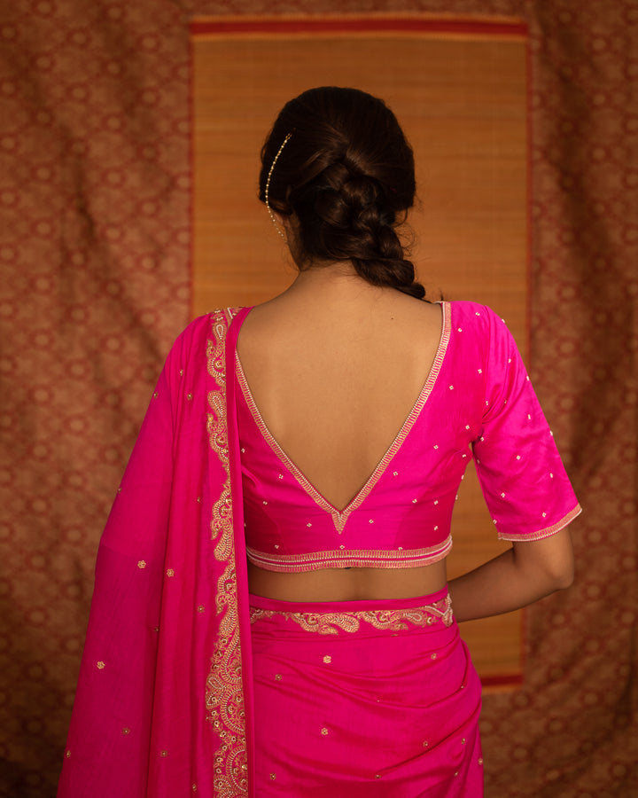 fuchsia hand embroidered silk saree with v neck blouse