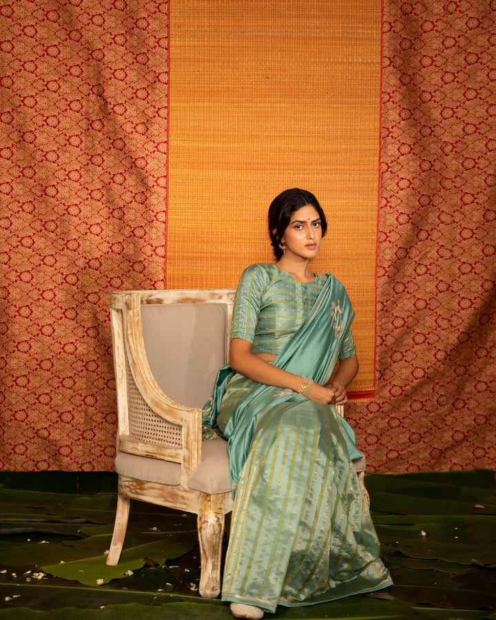teal half and half hand embroidered saree with blouse