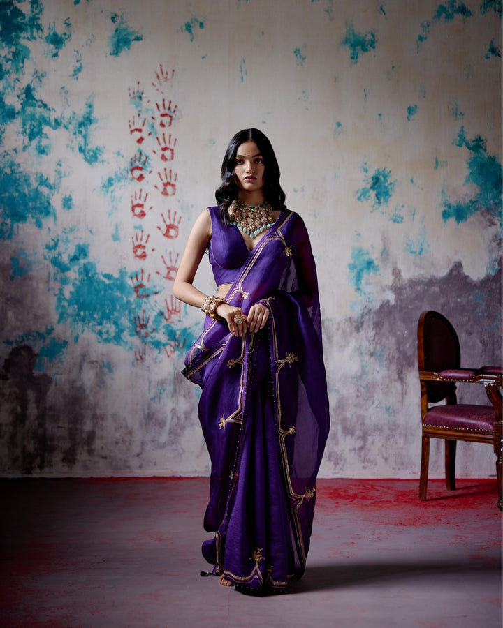 purple half and half saree with blouse