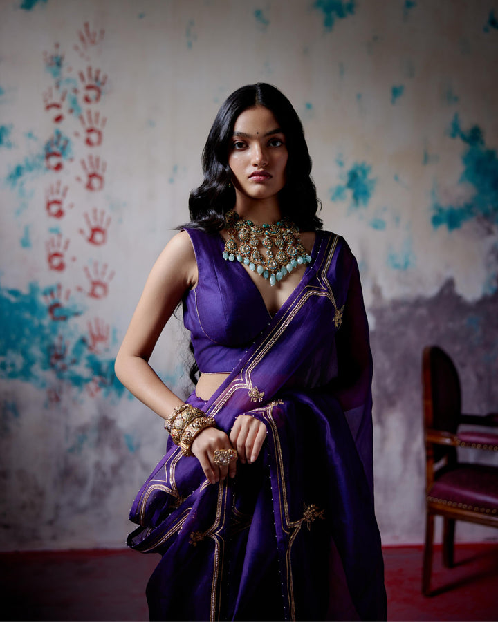 purple half and half saree with blouse