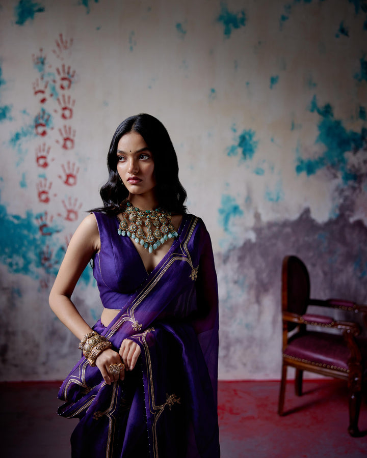 purple half and half saree with blouse
