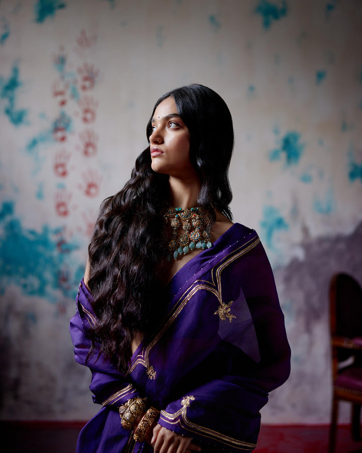 purple half and half saree with blouse