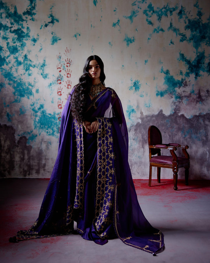 purple half and half saree with blouse