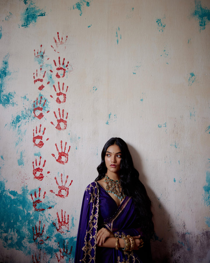 purple half and half saree with blouse