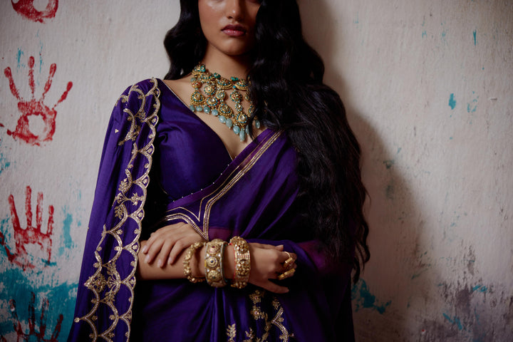 purple half and half saree with blouse