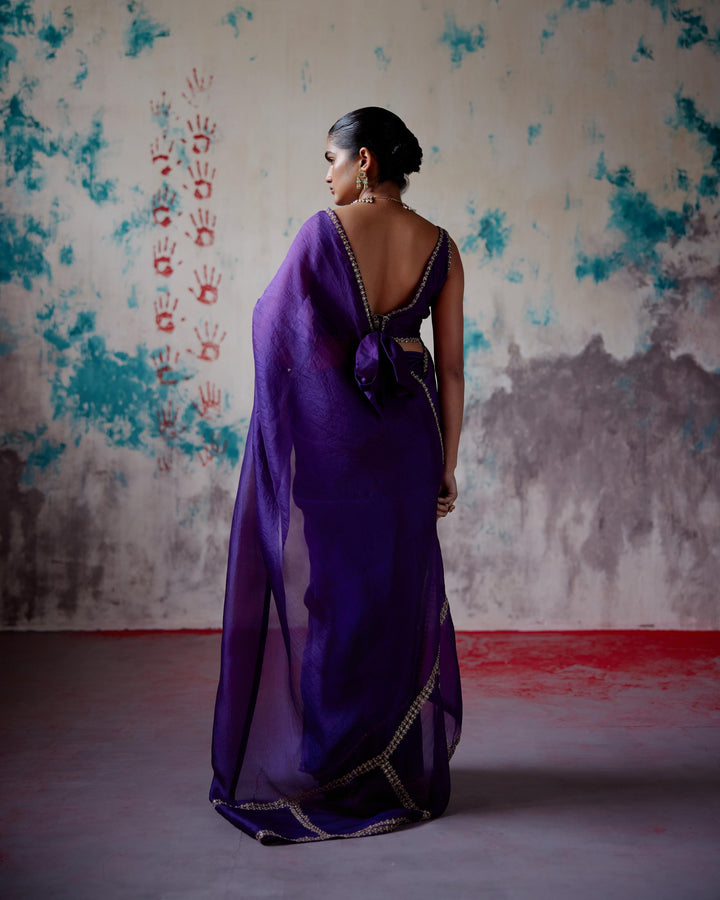 purple corset blouse with half and half saree