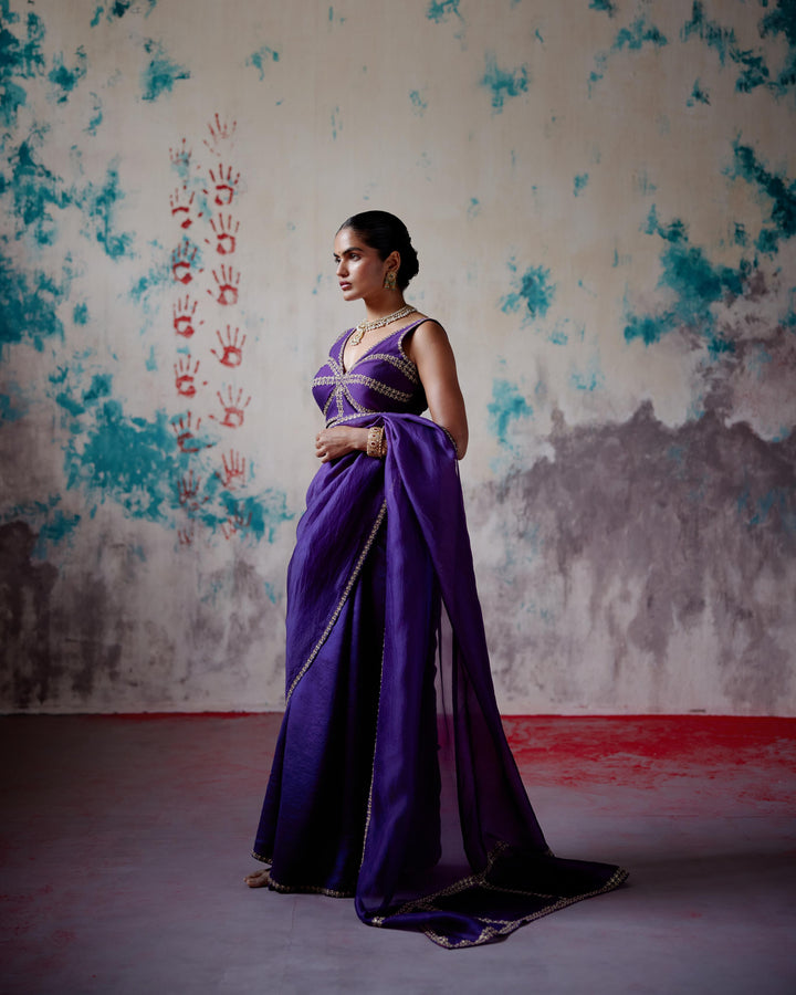 purple corset blouse with half and half saree