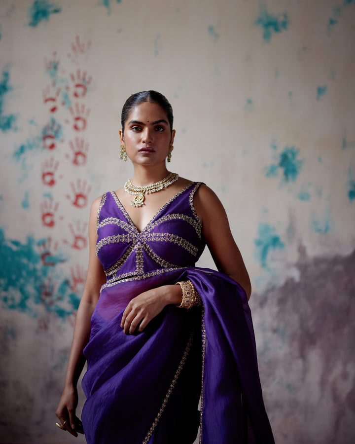 purple corset blouse with half and half saree