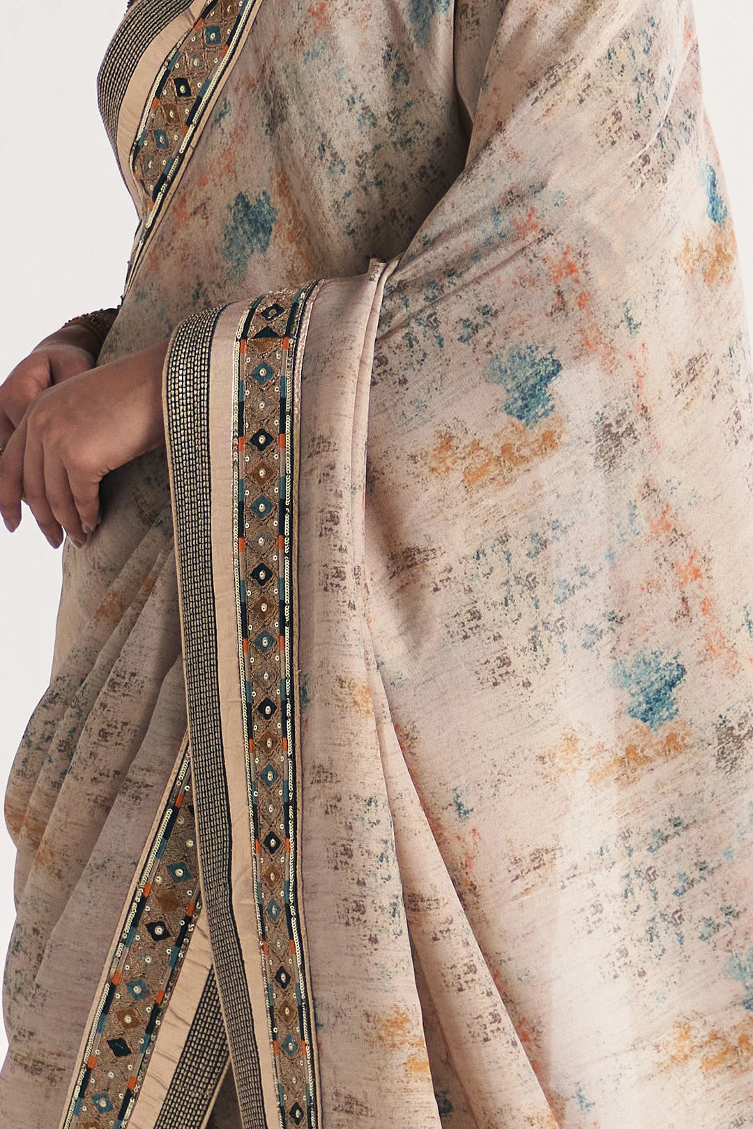 Close-up of a floral saree with intricate border details