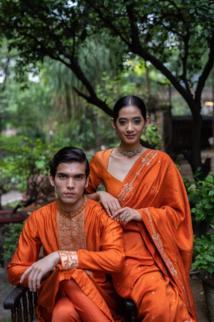 rust orange hand embroidered silk saree