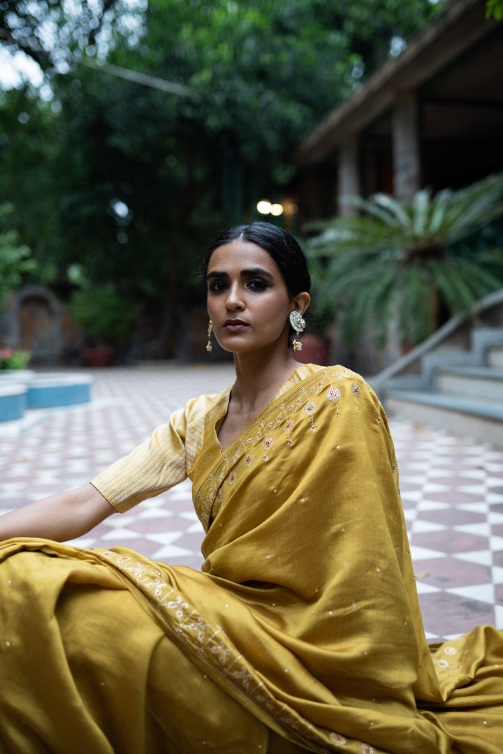 molten gold yellow hand embroidered saree with blouse