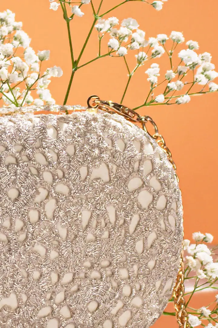 Ivory Cutwork Capsule Clutch