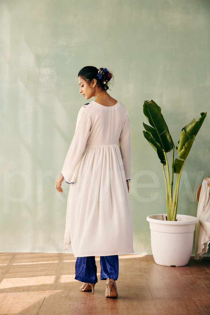 mid bust yoke with deep neck and gathered ghera with bell sleeve comes along with pleated pant