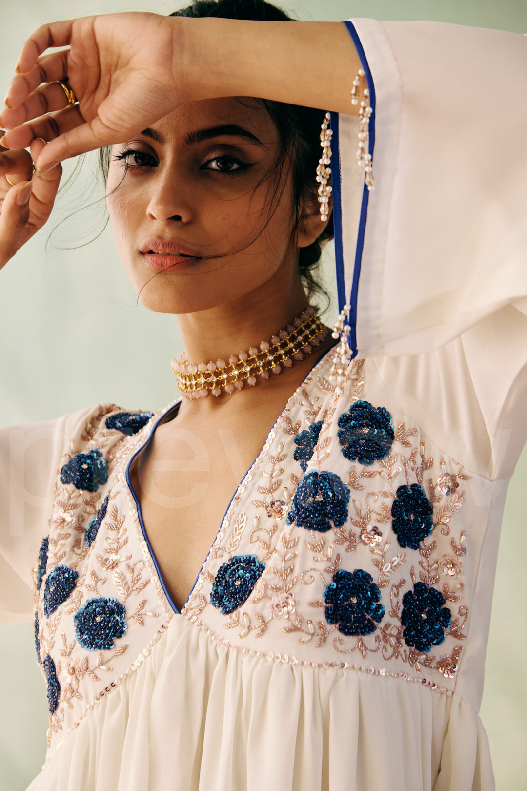 mid bust yoke with deep neck and gathered ghera with bell sleeve comes along with pleated pant