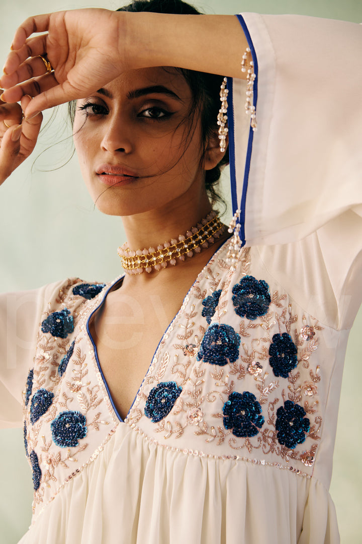 mid bust yoke with deep neck and gathered ghera with bell sleeve comes along with pleated pant