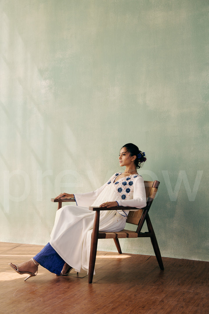 mid bust yoke with deep neck and gathered ghera with bell sleeve comes along with pleated pant