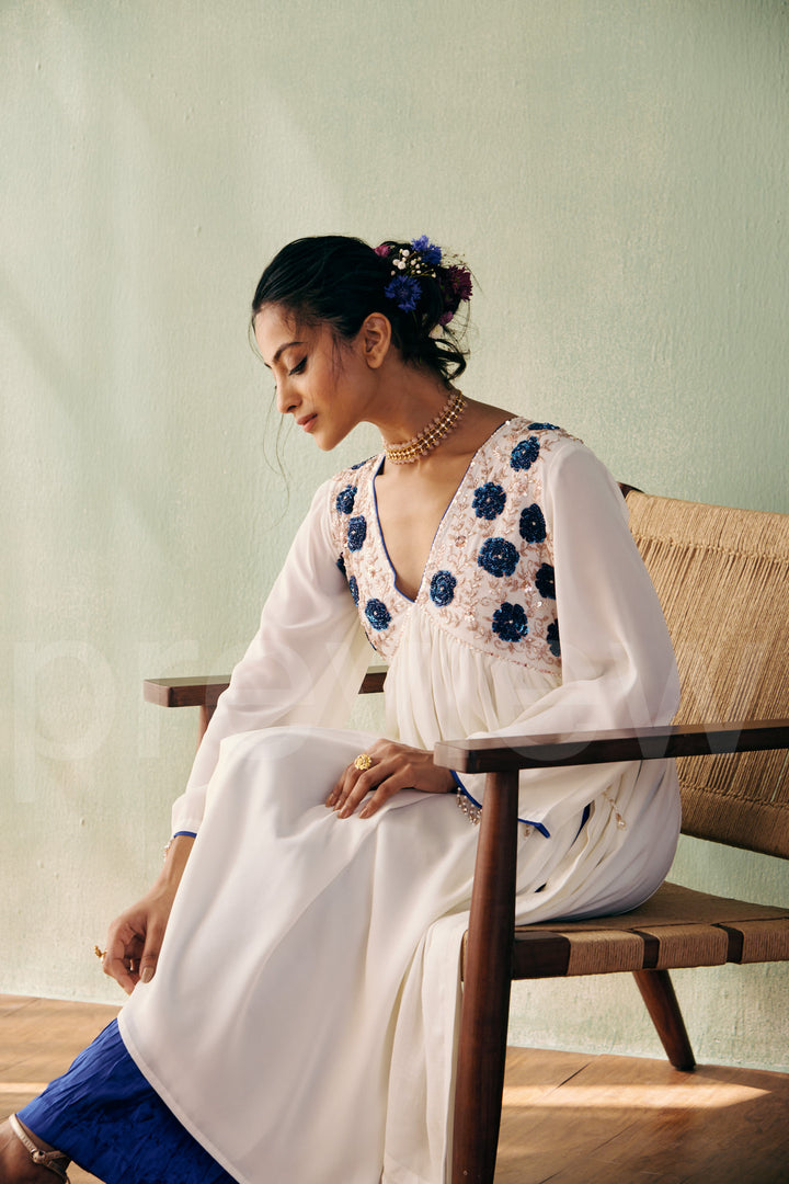 mid bust yoke with deep neck and gathered ghera with bell sleeve comes along with pleated pant