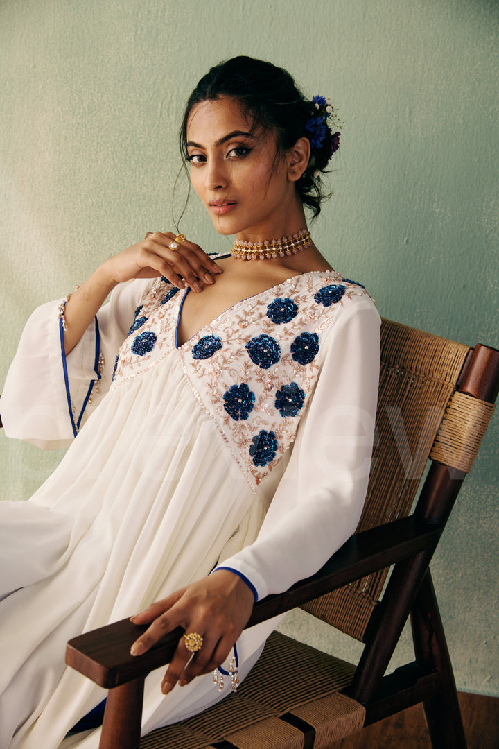 mid bust yoke with deep neck and gathered ghera with bell sleeve comes along with pleated pant