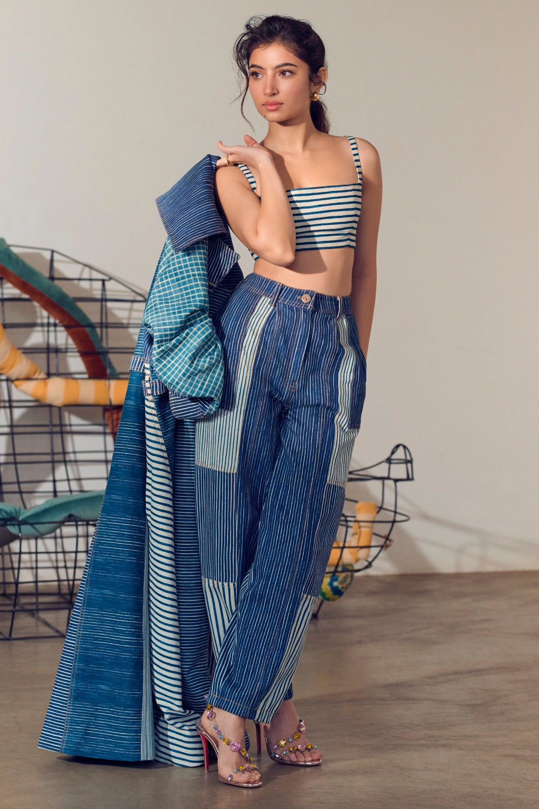 Sara Arjun in Selah Trench, Joyce Bustier & Jax Jeans