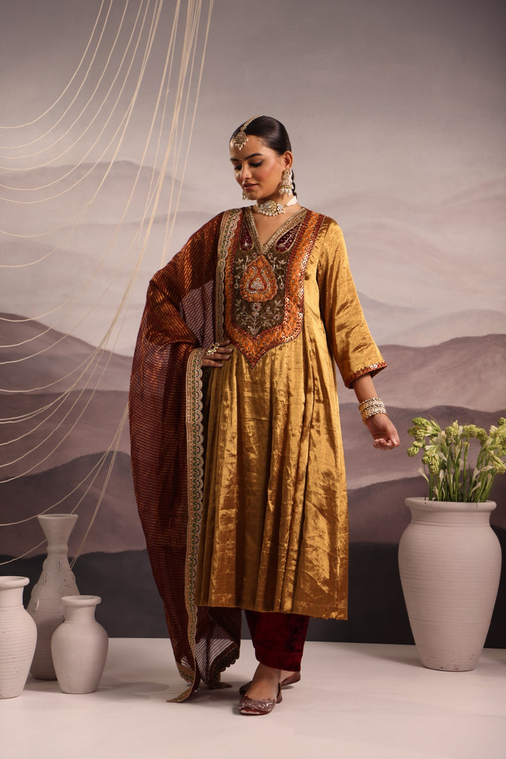 gold tissue kalidar with antique look yoke and maroon velvet salwar