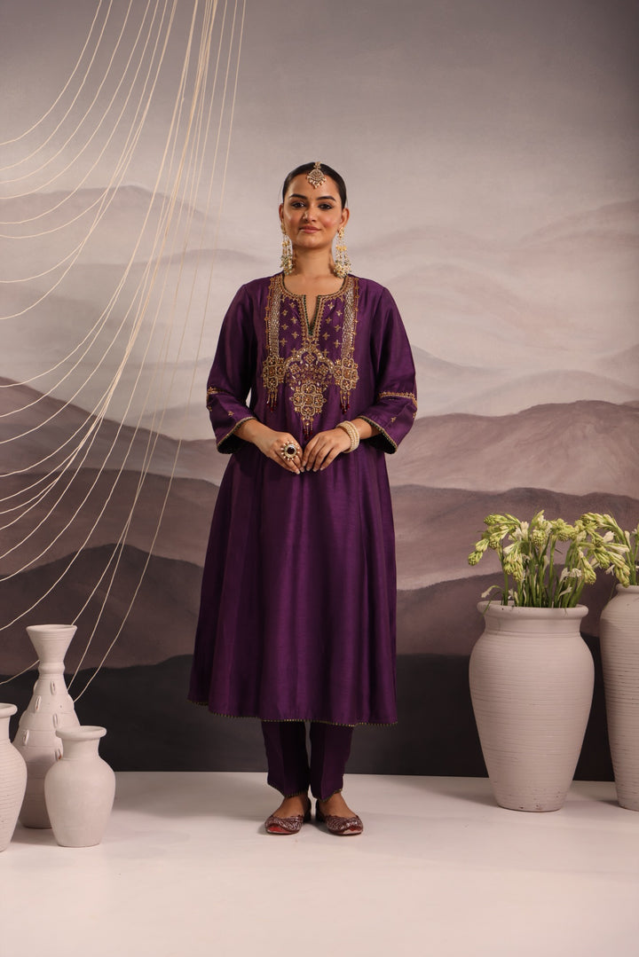 purple silk kurta set with hand embroidered yoke and beaded tassels