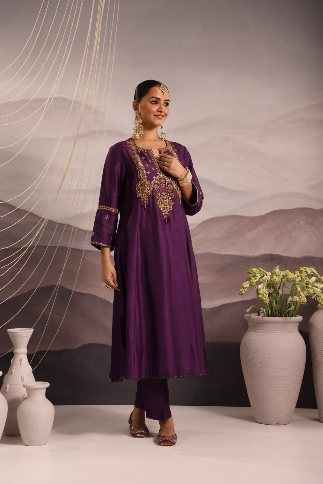 purple silk kurta set with hand embroidered yoke and beaded tassels