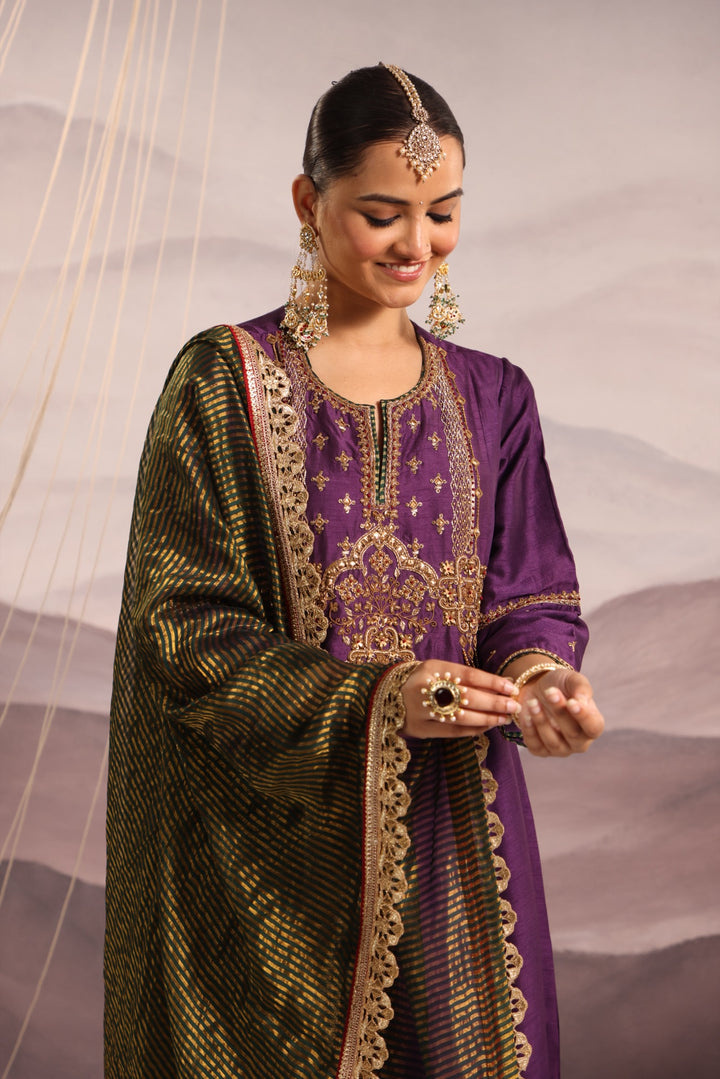 purple silk kurta set with hand embroidered yoke and beaded tassels