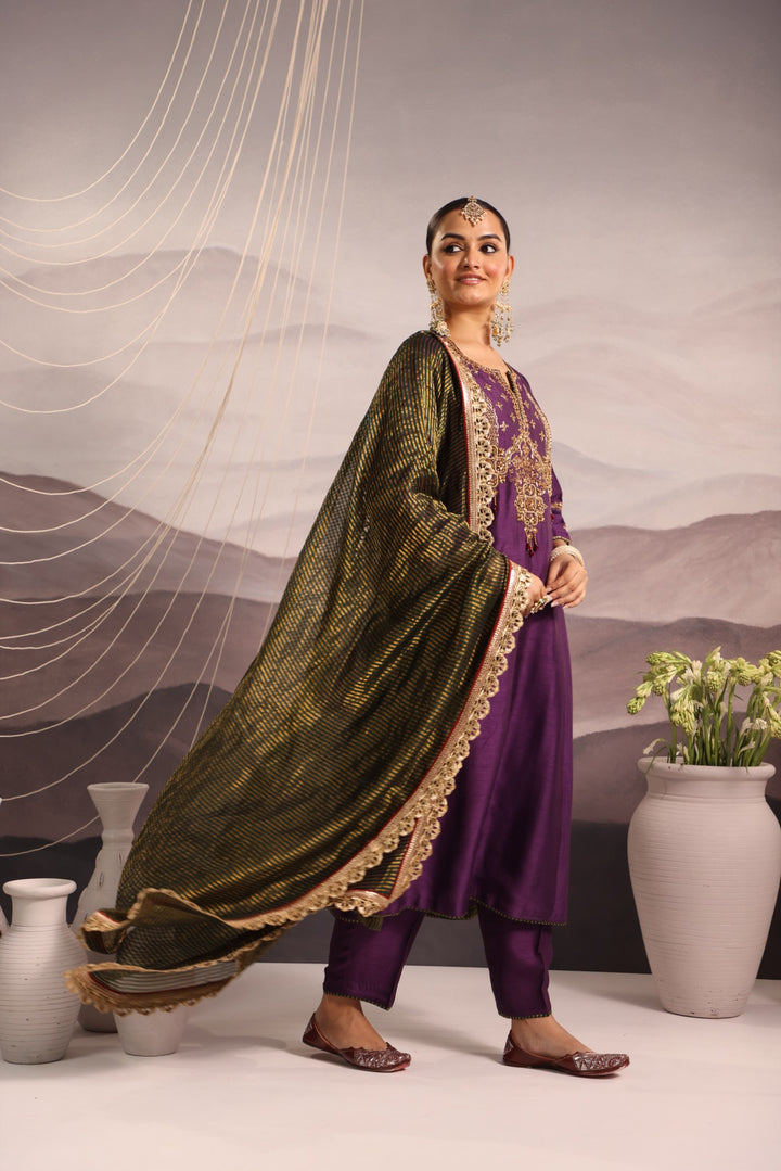 purple silk kurta set with hand embroidered yoke and beaded tassels