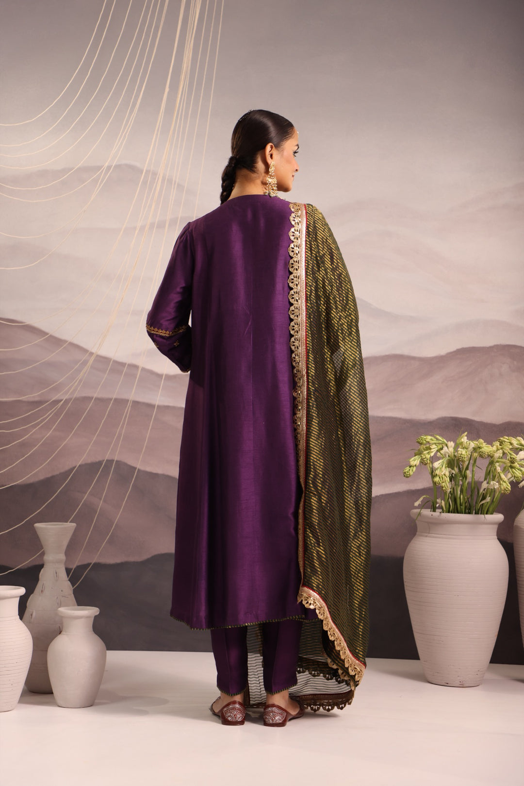 purple silk kurta set with hand embroidered yoke and beaded tassels