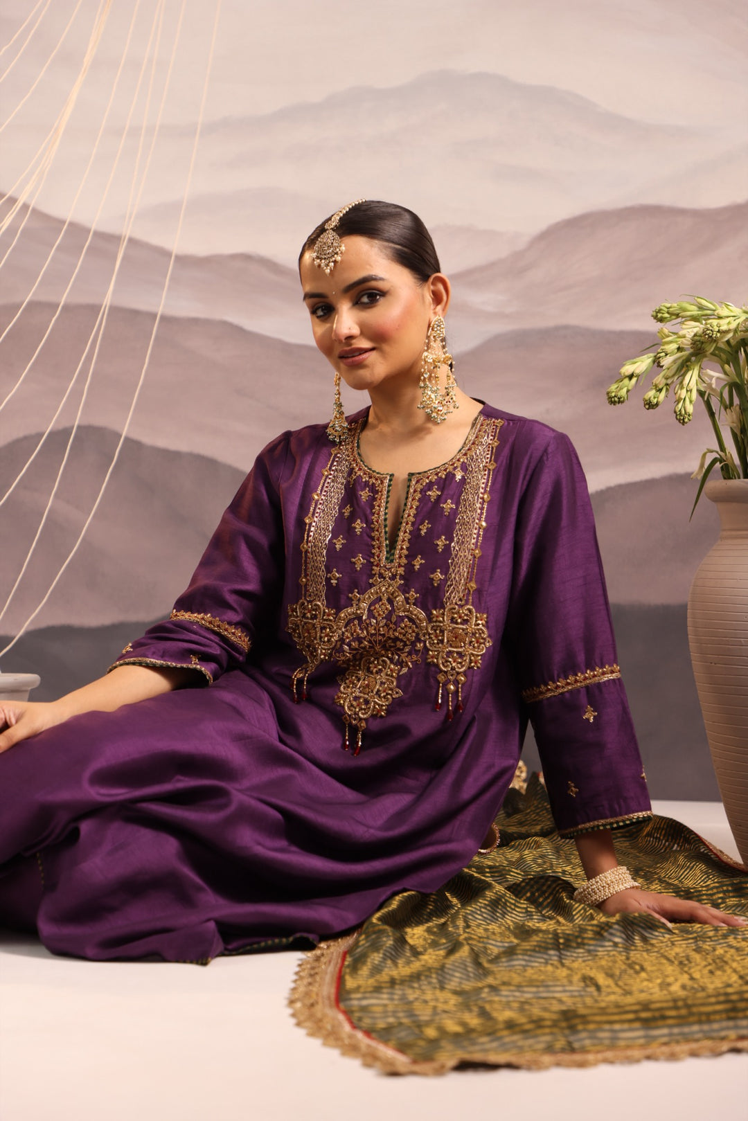 purple silk kurta set with hand embroidered yoke and beaded tassels