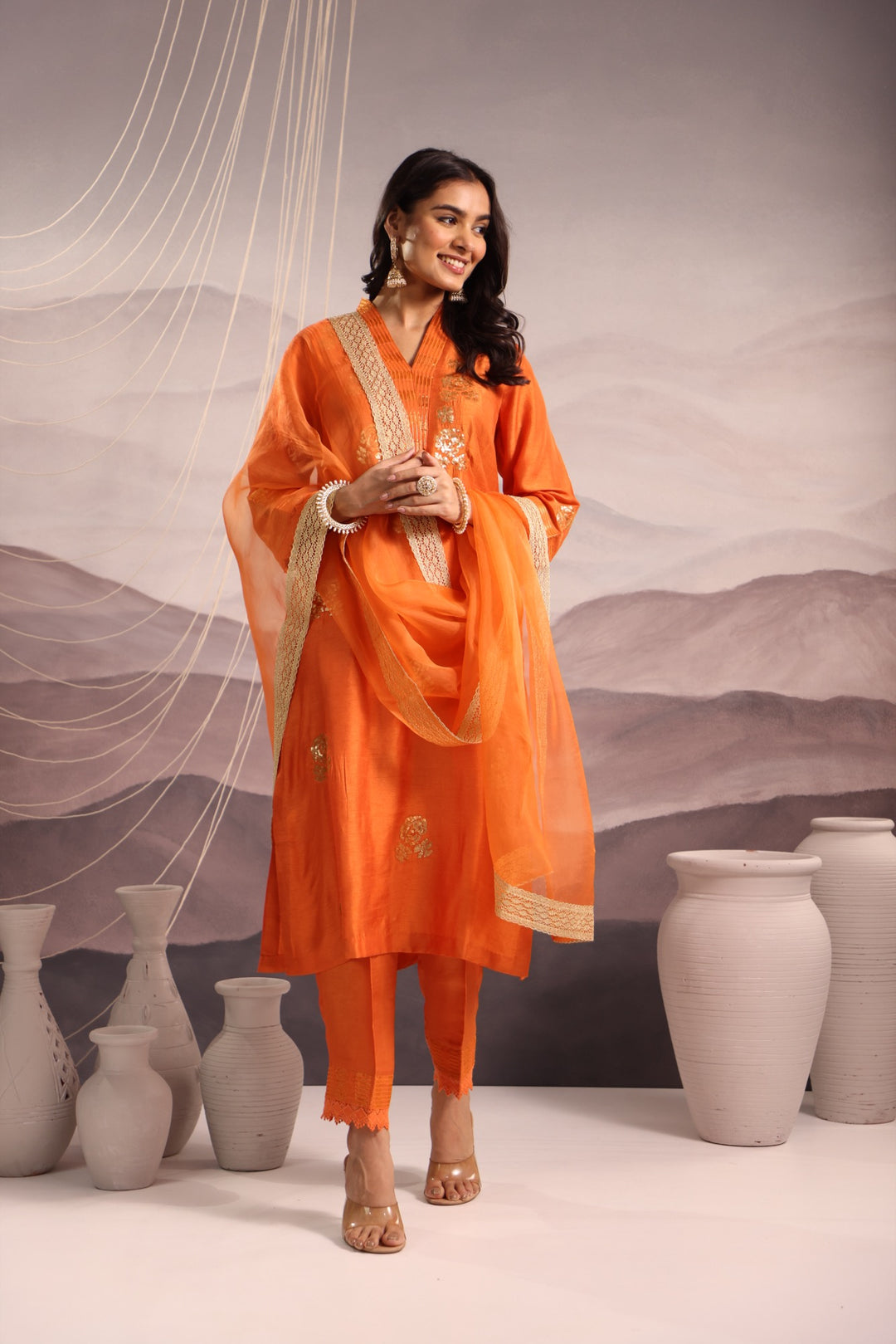 orange embroidered v neck silk kurta set