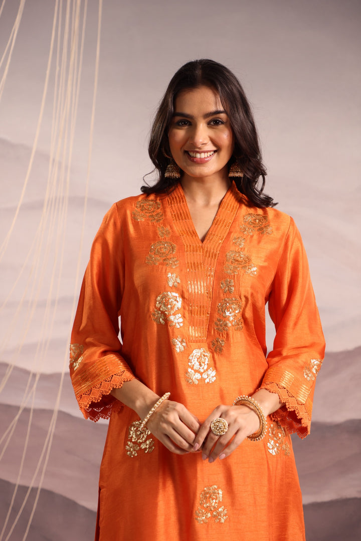 orange embroidered v neck silk kurta set