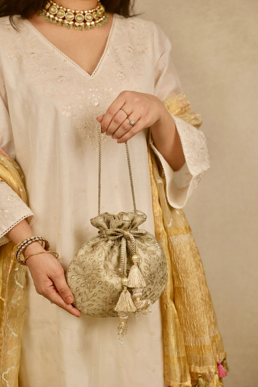 tarang cutwork potli-light gold