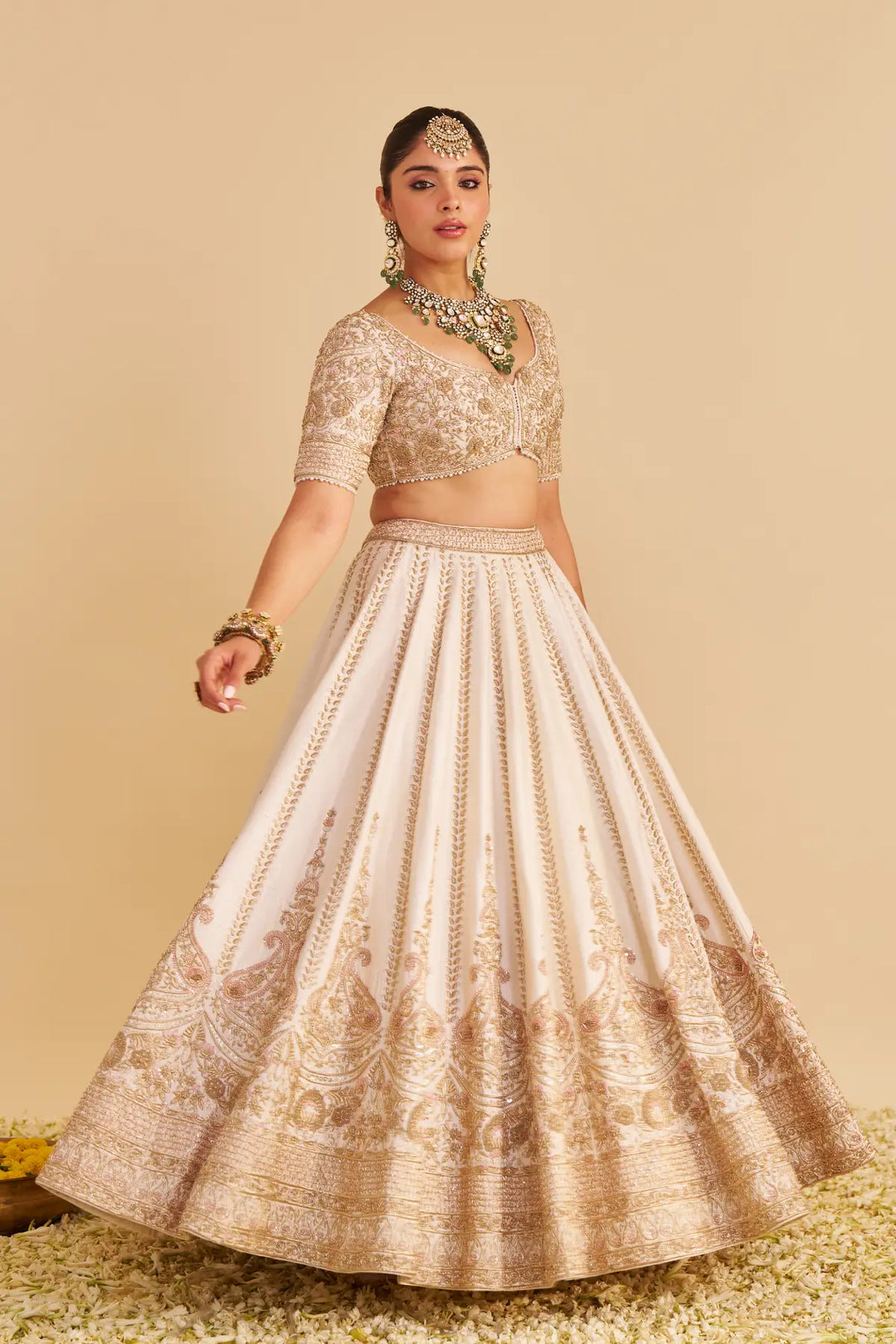 Woman wearing a traditional embroidered outfit on a beige background